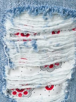 Alexander McQueen distressed folk embroidery jeans