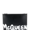 Alexander McQueen paint style logo clutch bag