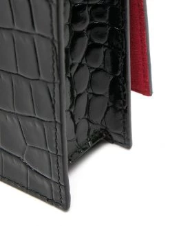 Alexander McQueen skull-embellished clutch bag