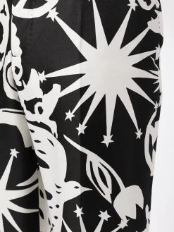 Alexander McQueen all-over print slim-fit trousers