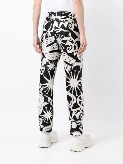 Alexander McQueen all-over print slim-fit trousers