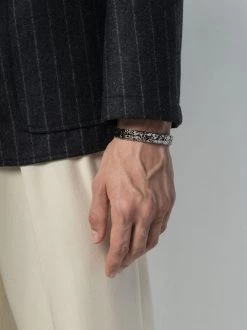 Alexander McQueen skull-engraved cuff bracelet