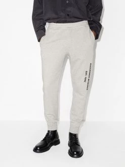 Alexander McQueen graffiti-print track pants