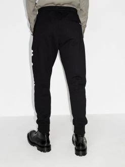 Alexander McQueen logo graffiti print track pants