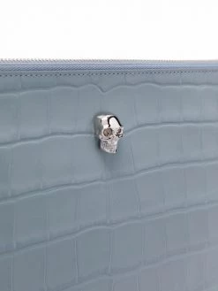 Alexander McQueen crocodile-effect skull-stud clutch bag