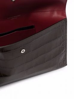 Alexander McQueen skull charm croc-embossed clutch bag